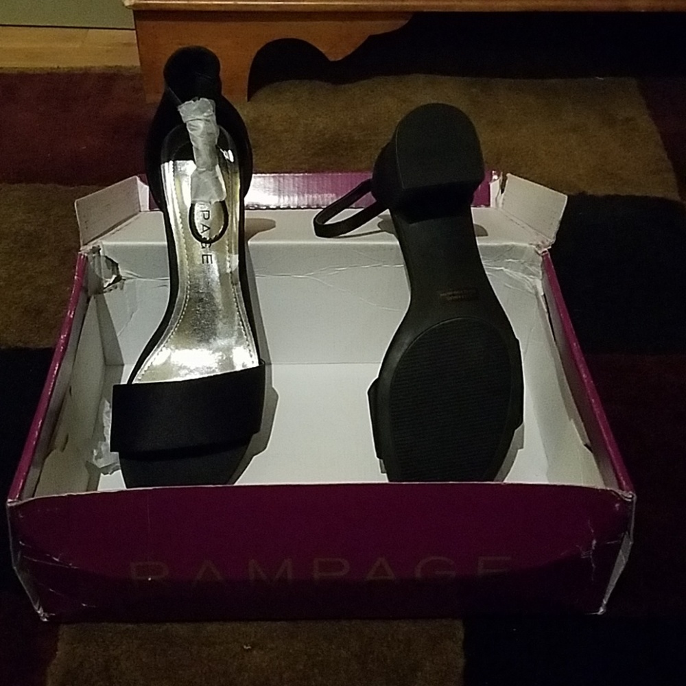 Black low heel, ankle strap dress shoe, never worn